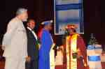 Mr Ibrahim Awal, former MD of Graphic congratulates Nana Konadu while President Rawlings looks on