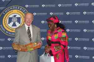 Nana Konadu presented traditional kente fabric to Dr Larry Penley President of the Thunderbird School of Management